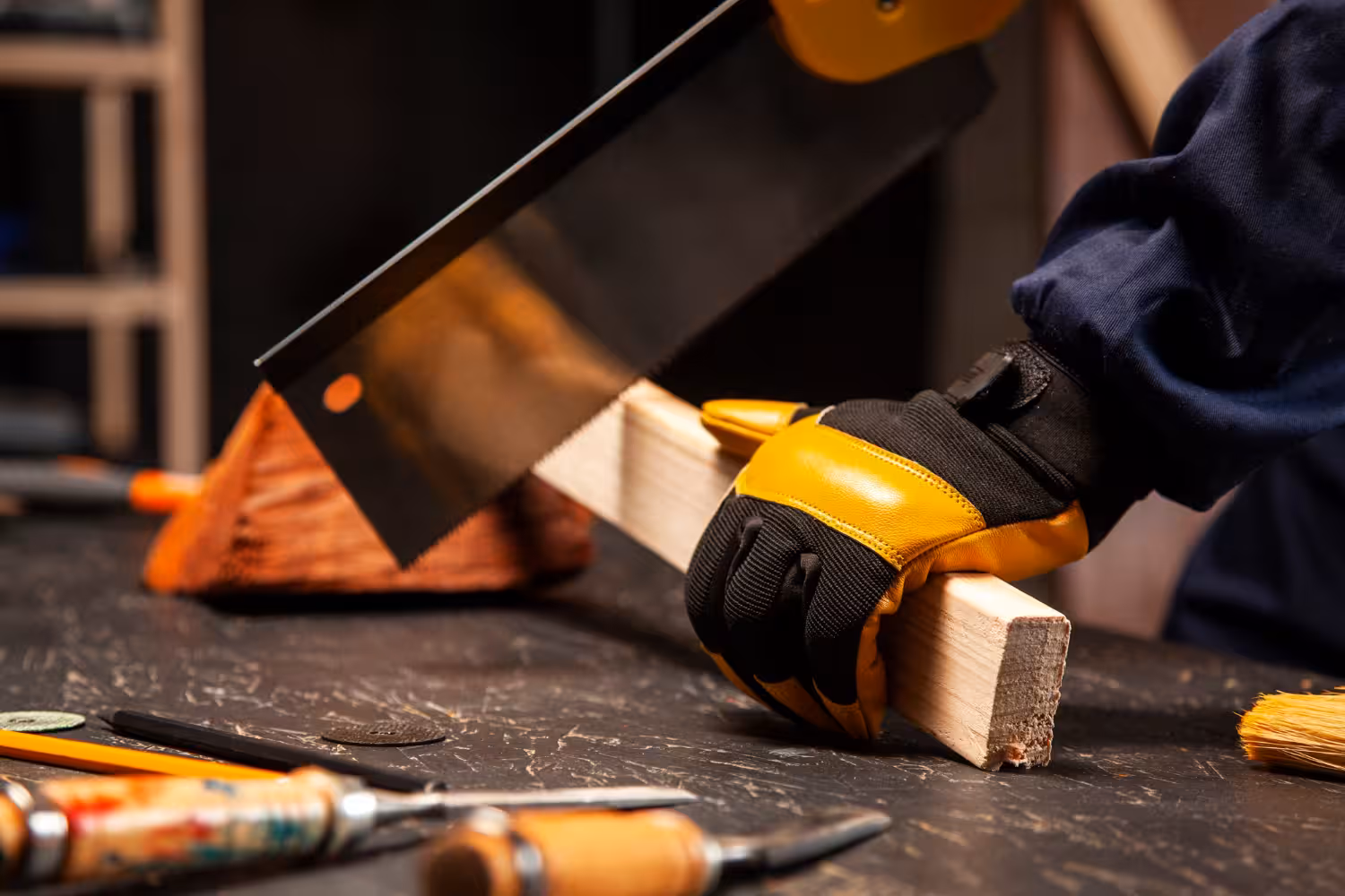 Worker cutting a piece of wood with precision
